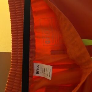 FIGS brand scrub pants in Size Large Petite. Coral color